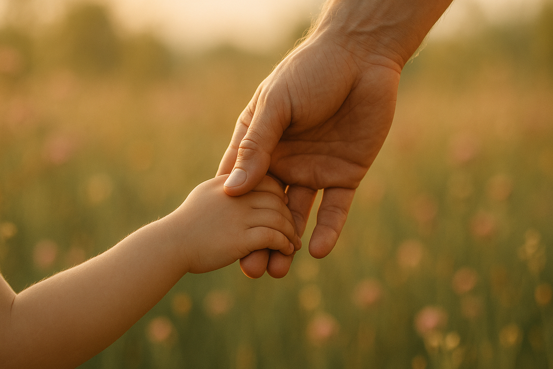 Adult hand tenderly cradling a child's hand symbolizing reparenting yourself and inner child healing