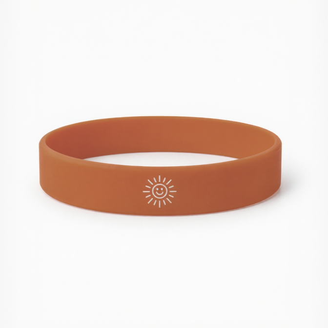 Orange wristband with a sun logo on a white background