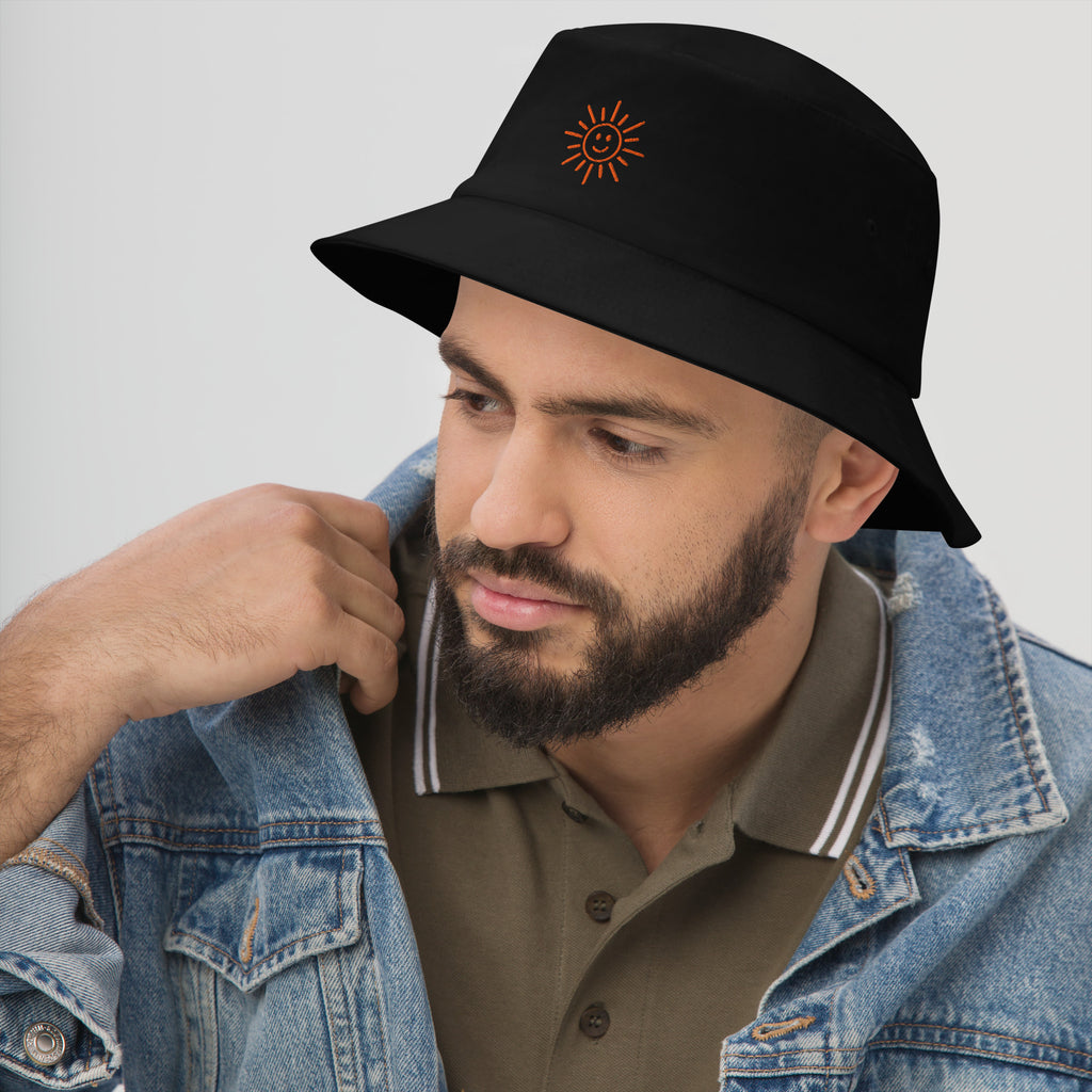 The Sunshine Project cotton bucket hat in black, angled front view