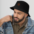 The Sunshine Project cotton bucket hat in black, angled front view