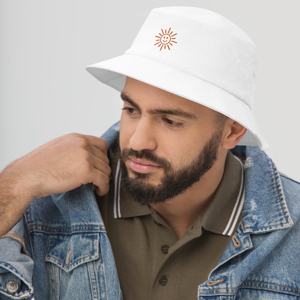 The Sunshine Project cotton bucket hat in white, angled front view