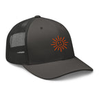 The Sunshine Project mesh-back trucker hat in charcoal gray, angled front view