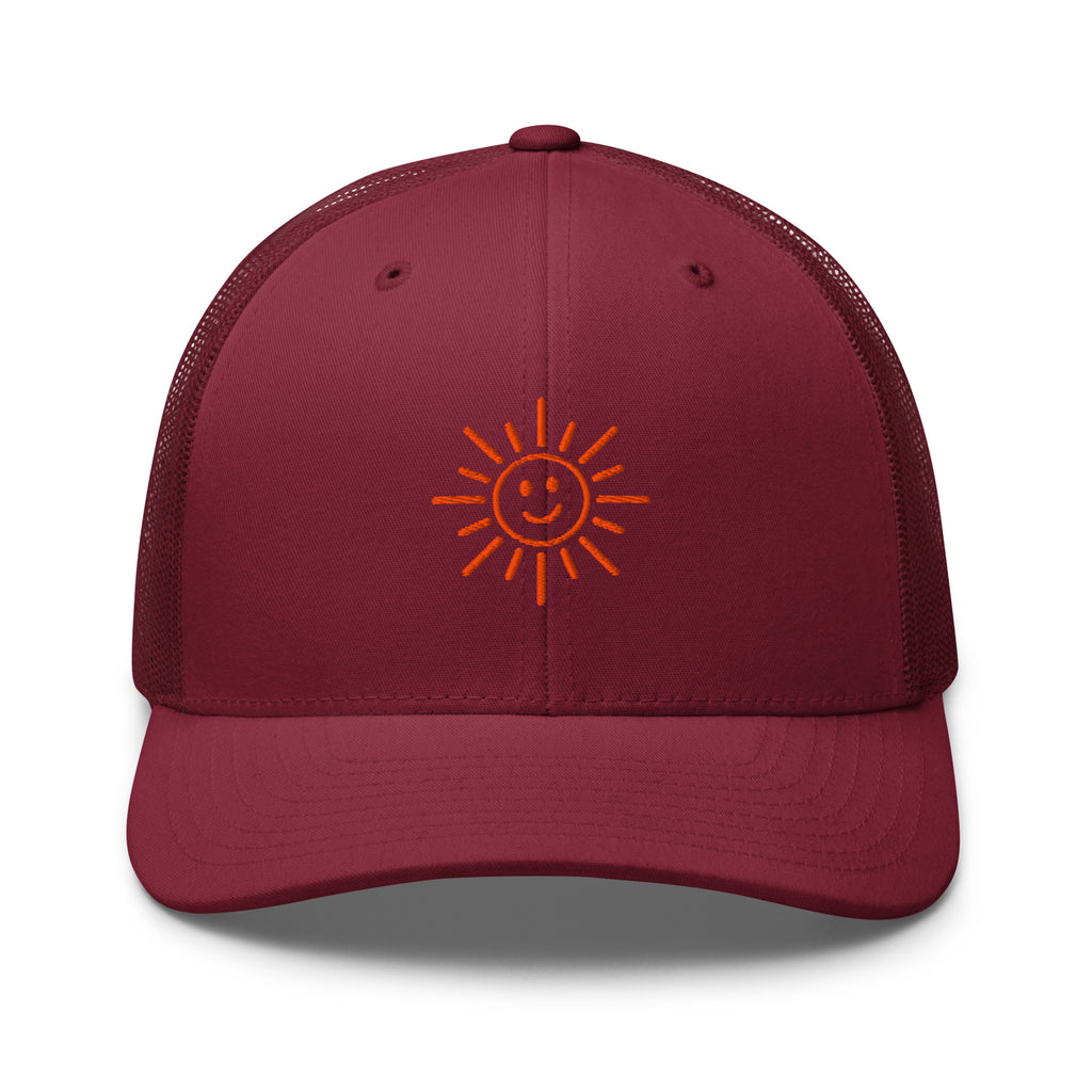 The Sunshine Project mesh-back trucker hat in cranberry red, front view