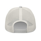 The Sunshine Project mesh-back trucker hat in silver, back view