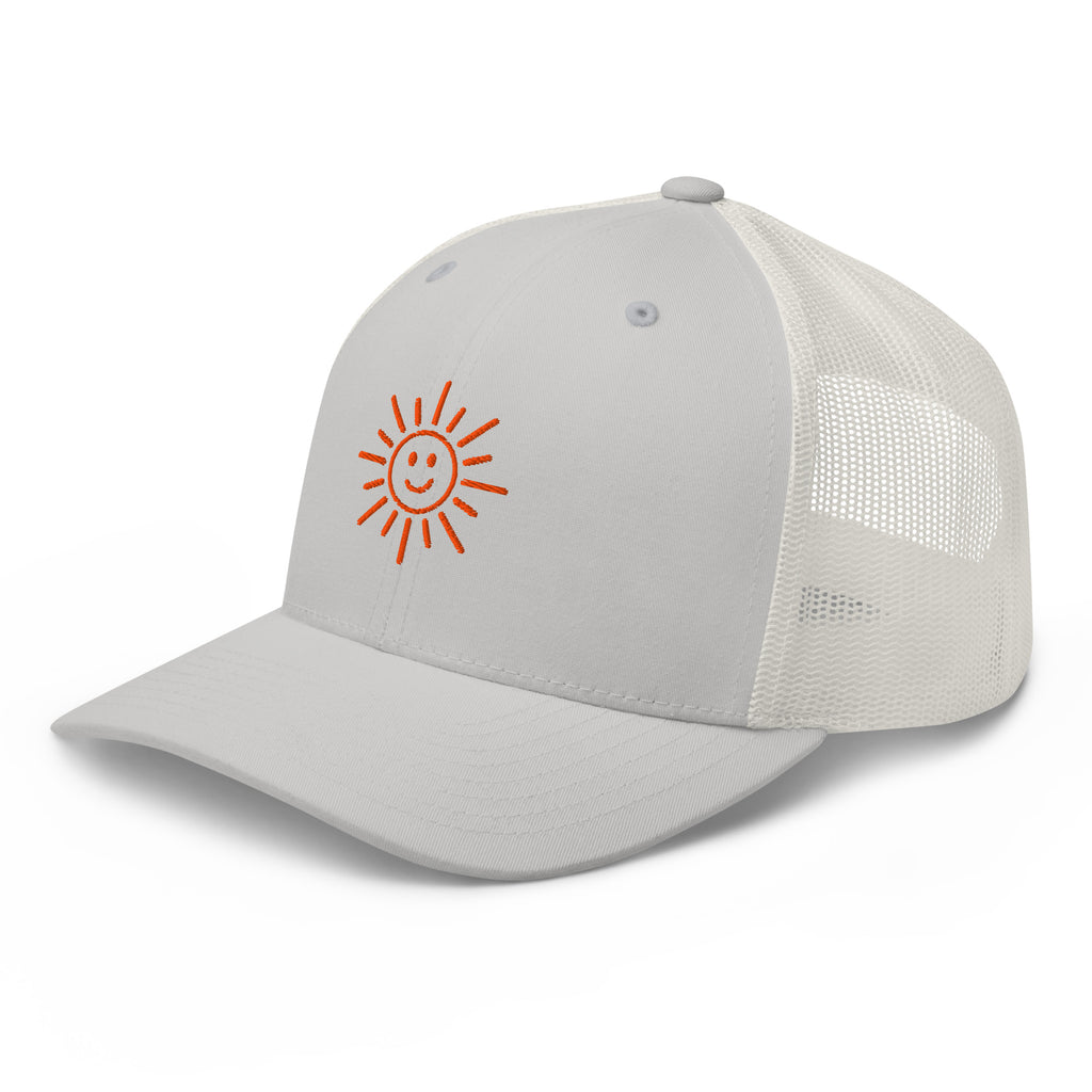 The Sunshine Project mesh-back trucker hat in silver, angled front view