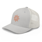 The Sunshine Project mesh-back trucker hat in silver, angled front view