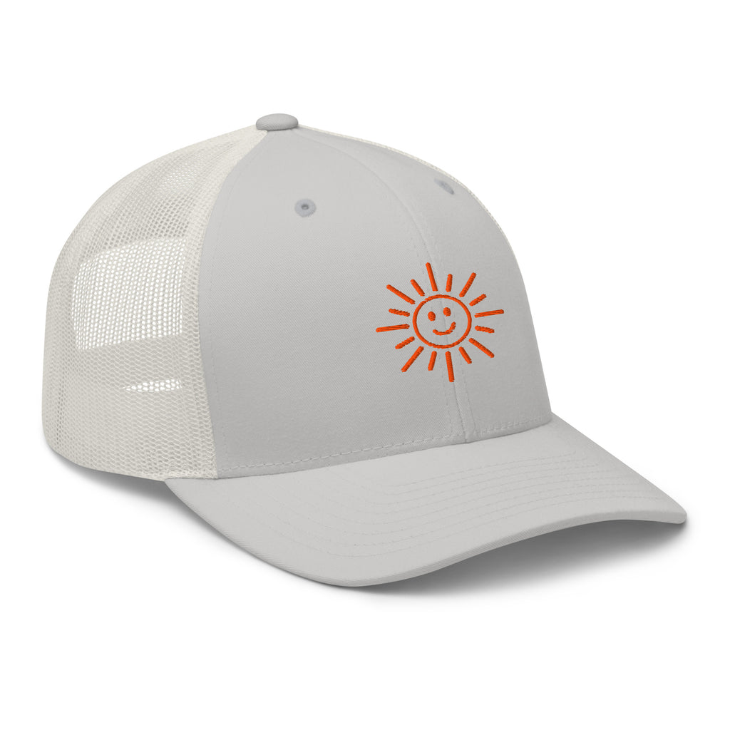 The Sunshine Project mesh-back trucker hat in silver, angled front view