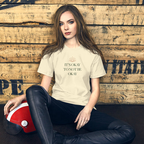 The Sunshine Project It's Okay to Not Be Okay tee in natural, front view