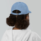 The Sunshine Project youth baseball cap in Blue, back view