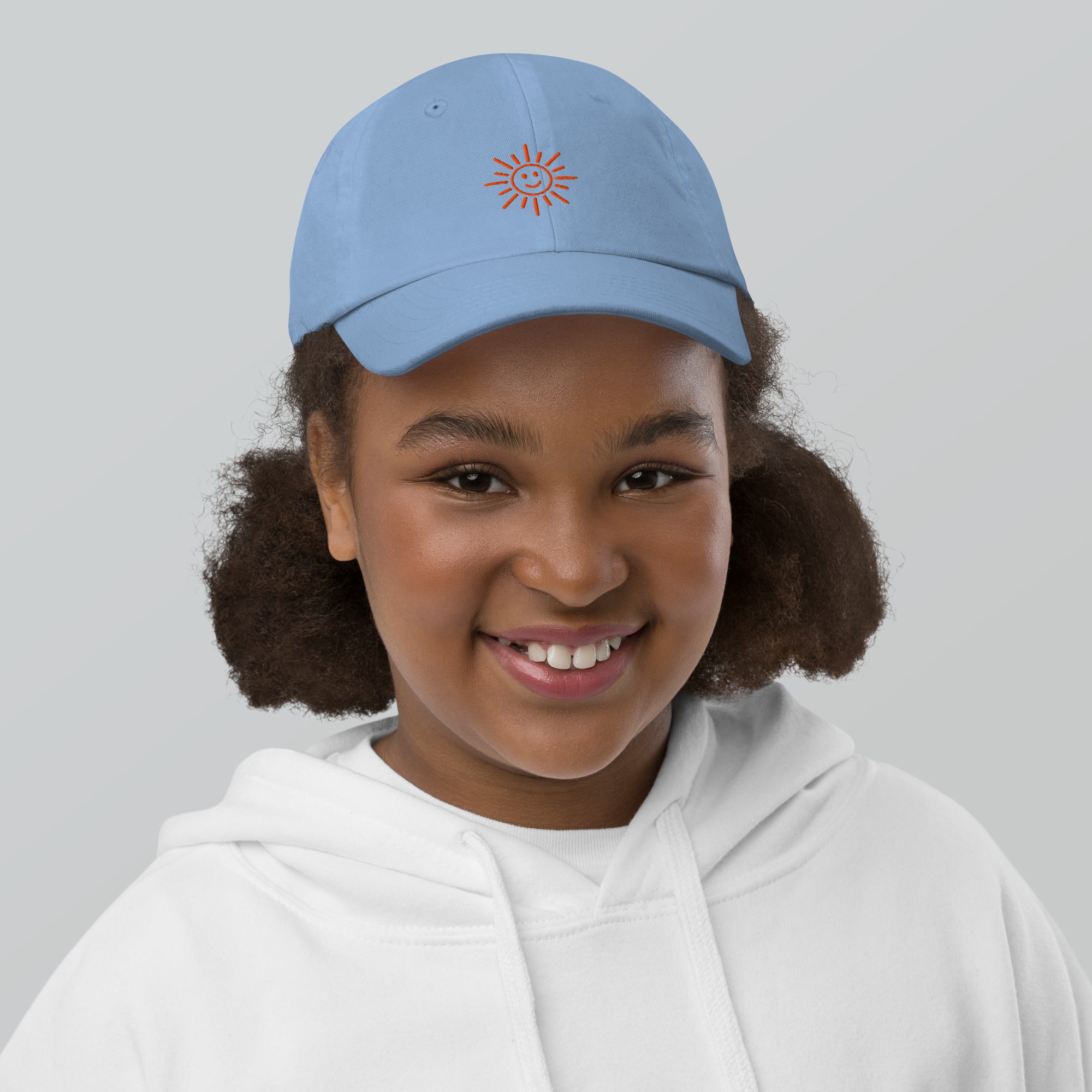 The Sunshine Project youth baseball cap in Blue, front view