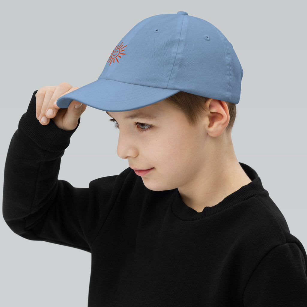 The Sunshine Project youth baseball cap in Blue, left side view