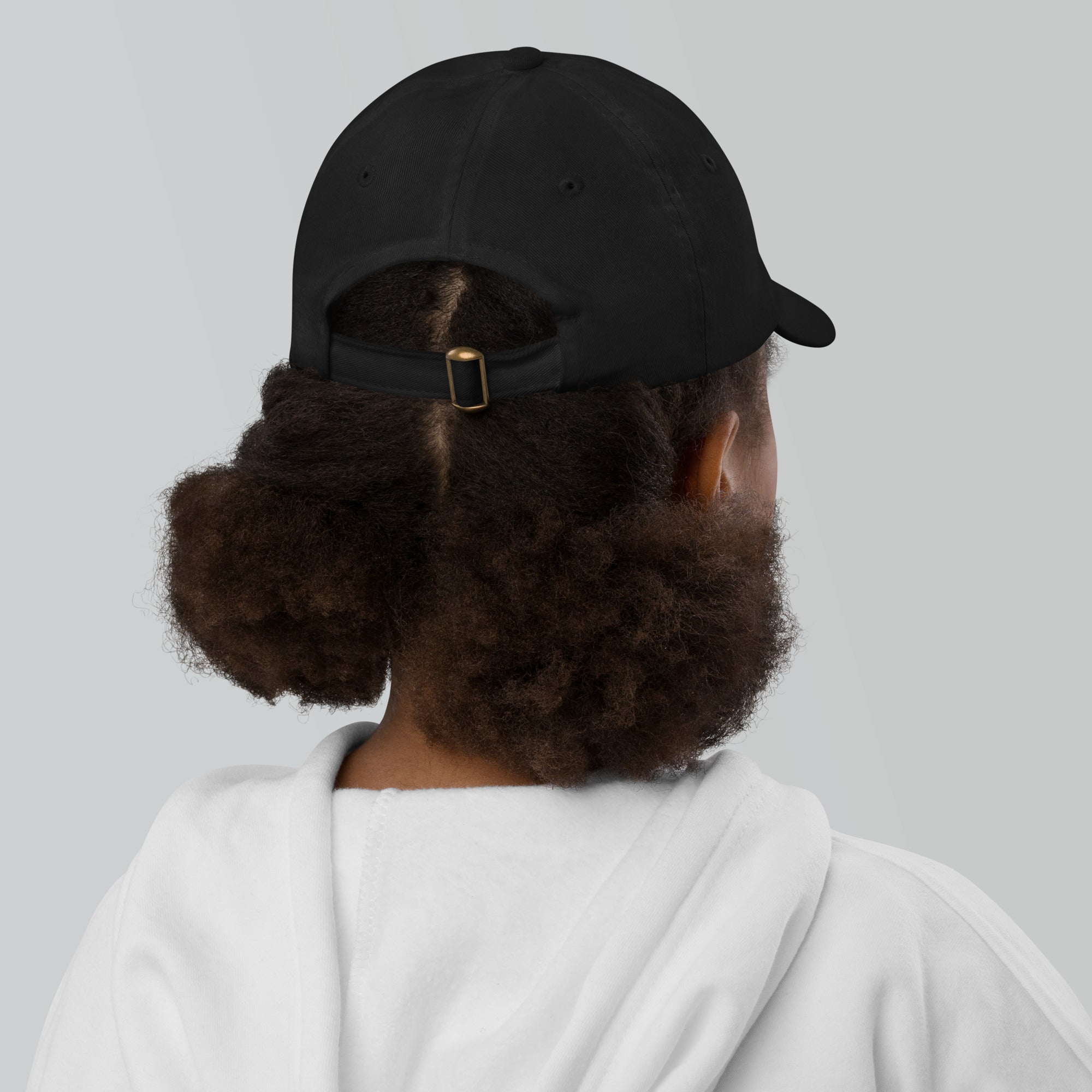 The Sunshine Project youth baseball cap in Black, back view