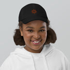 The Sunshine Project youth baseball cap in Black, front view