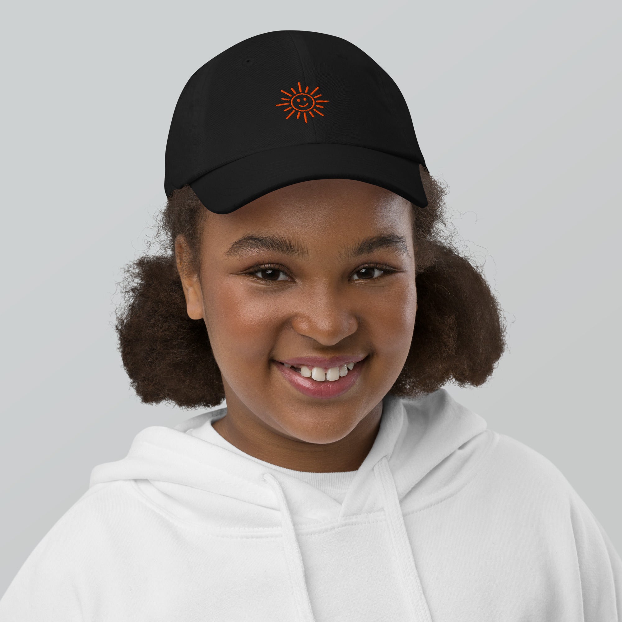 The Sunshine Project youth baseball cap in Black, front view