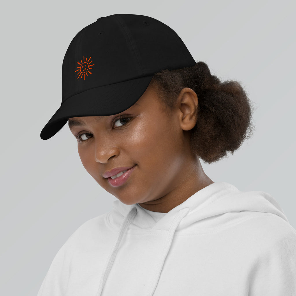 The Sunshine Project youth baseball cap in Black, left side view