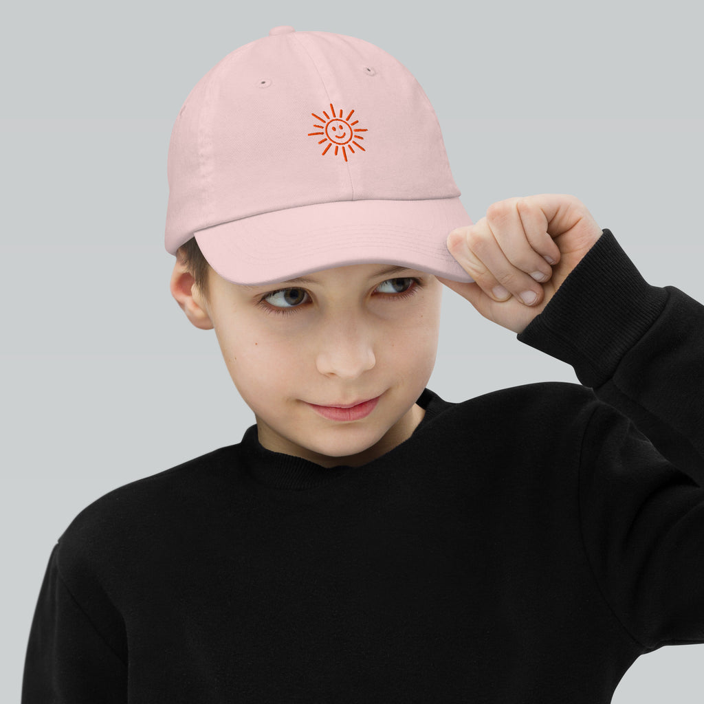 The Sunshine Project youth baseball cap in Pink, front view