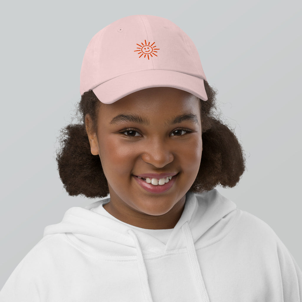 The Sunshine Project youth baseball cap in Pink, front view
