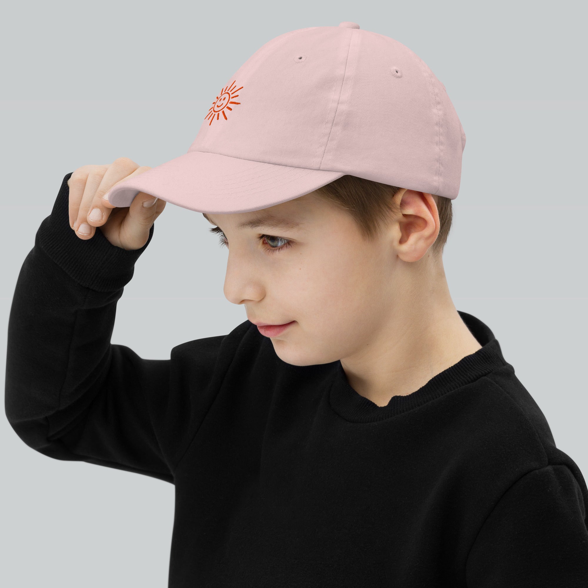 The Sunshine Project youth baseball cap in Pink, left side view