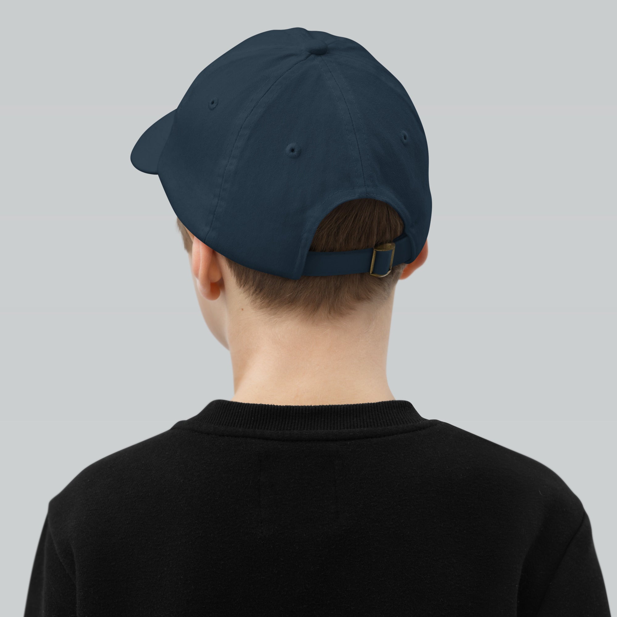 The Sunshine Project youth baseball cap in Navy, back view