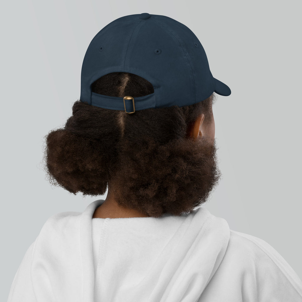 The Sunshine Project youth baseball cap in Navy, back view