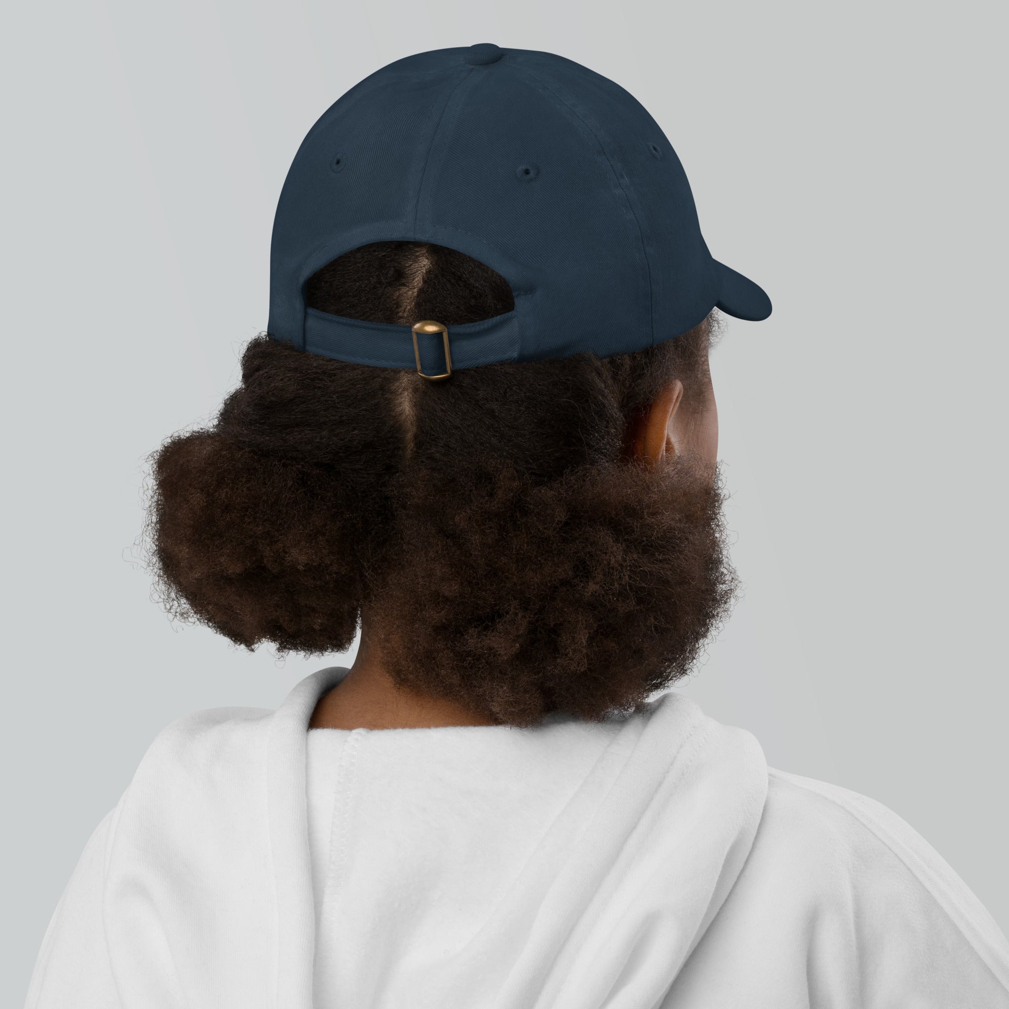 The Sunshine Project youth baseball cap in Navy, back view