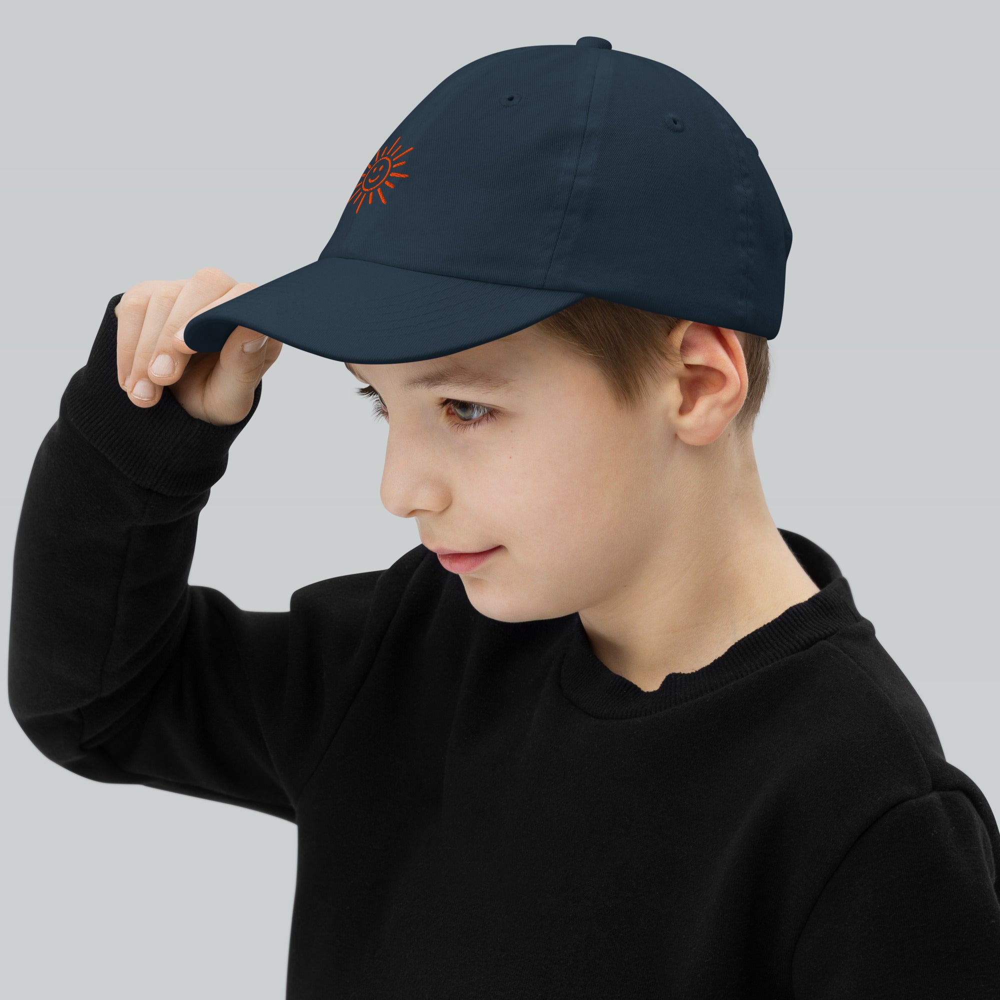 The Sunshine Project youth baseball cap in Navy, left side view