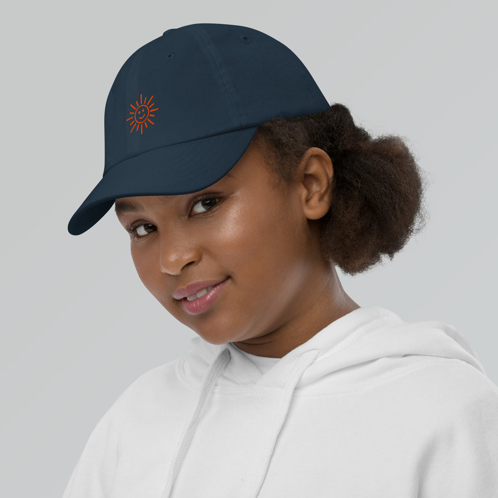 The Sunshine Project youth baseball cap in Navy, left side view