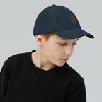 The Sunshine Project youth baseball cap in Navy, right side view