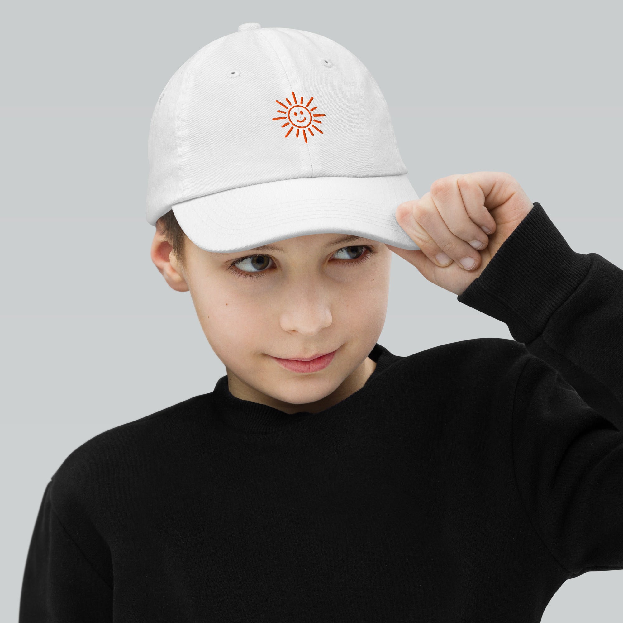 The Sunshine Project youth baseball cap in White, front view