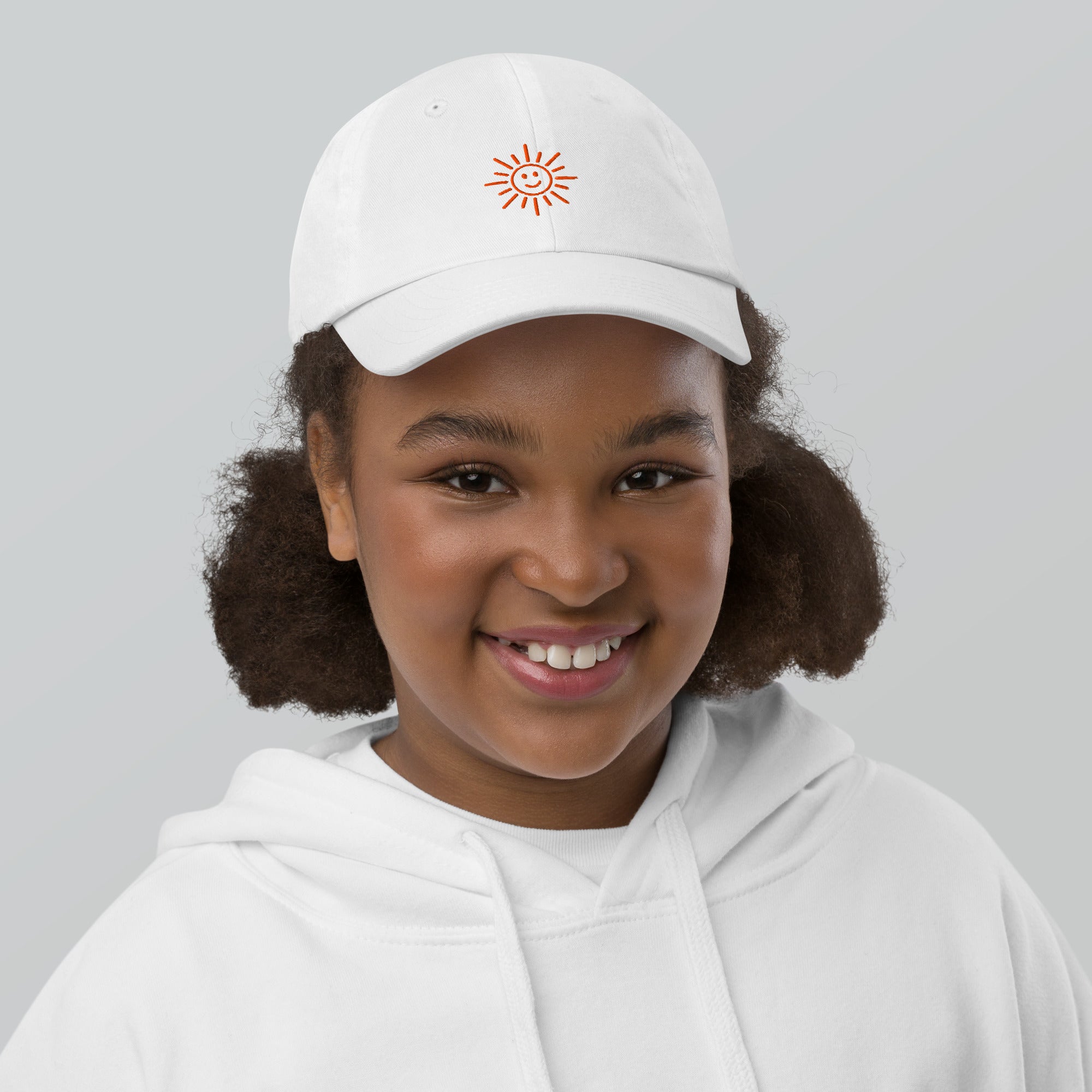 The Sunshine Project youth baseball cap in White, front view