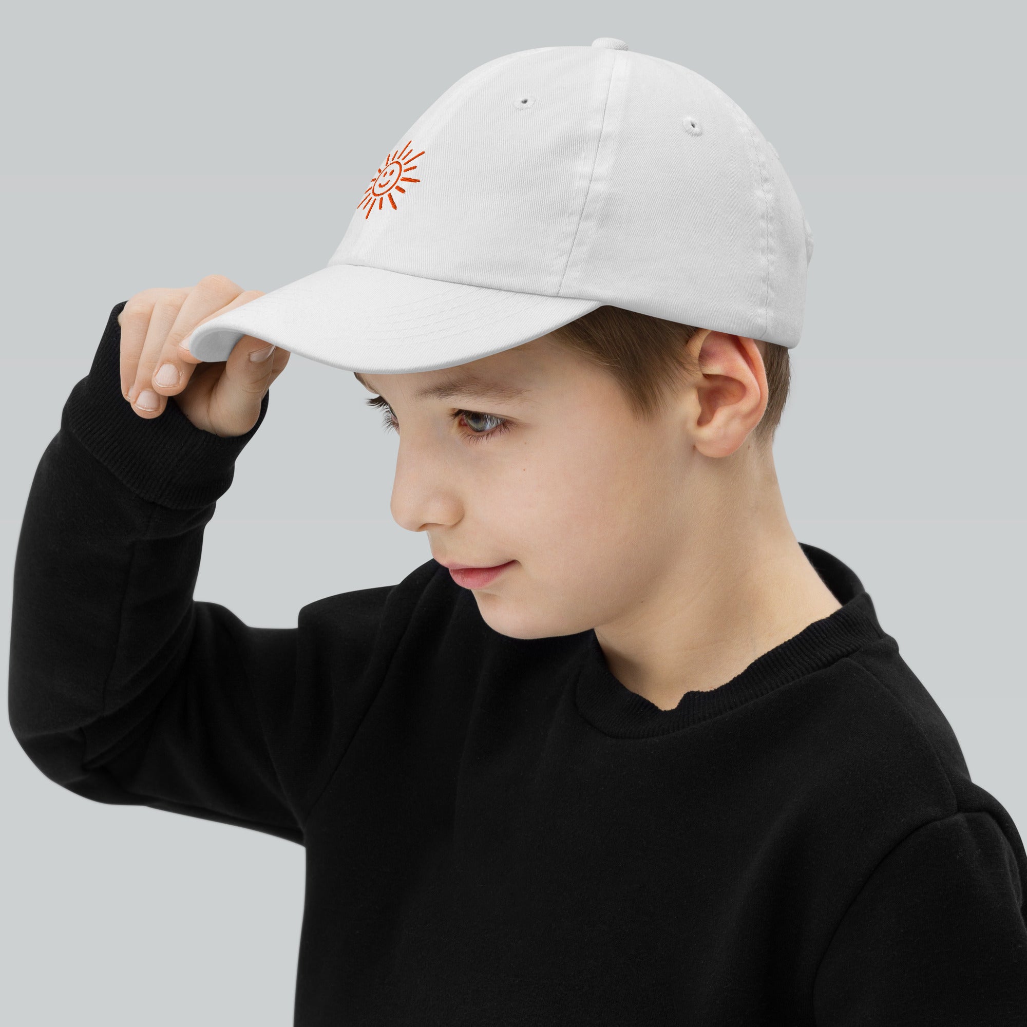 The Sunshine Project youth baseball cap in White, left side view