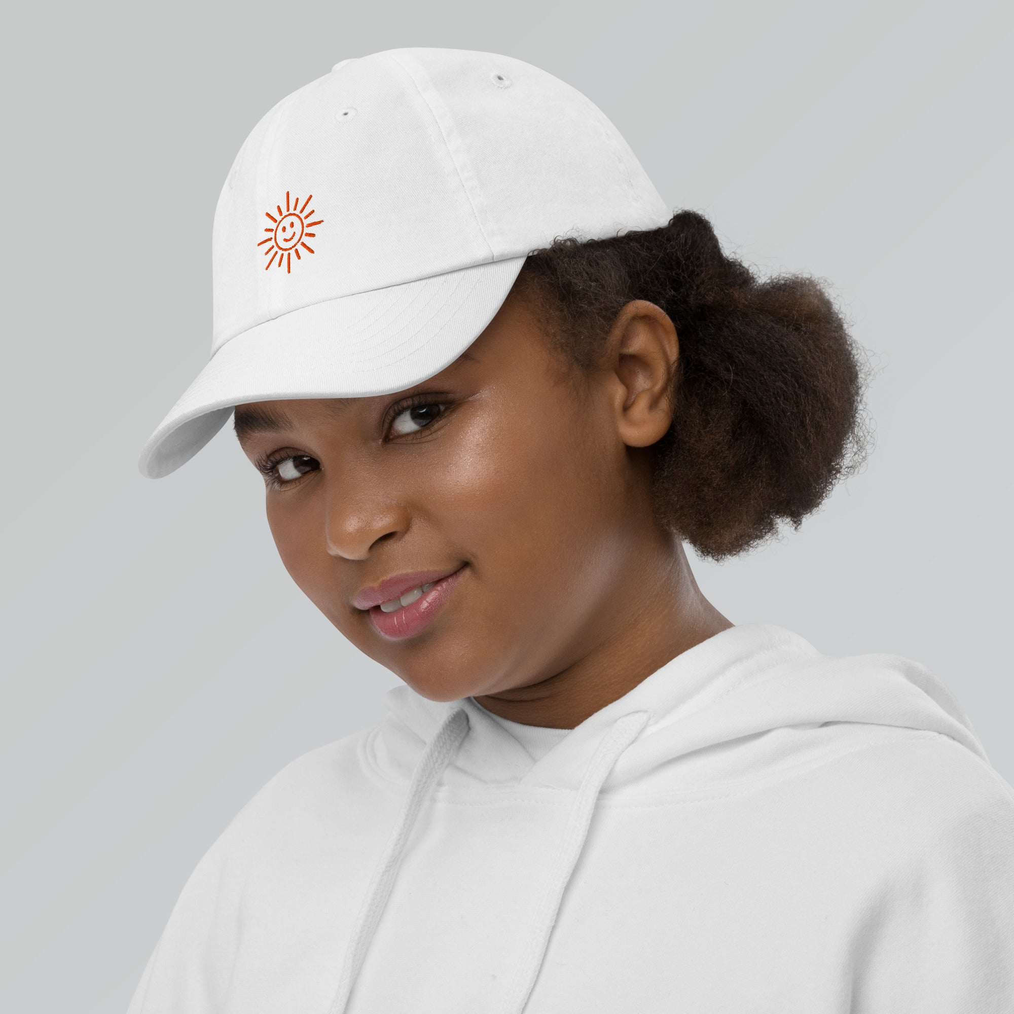 The Sunshine Project youth baseball cap in White, left side view
