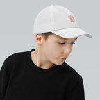 The Sunshine Project youth baseball cap in White, right side view